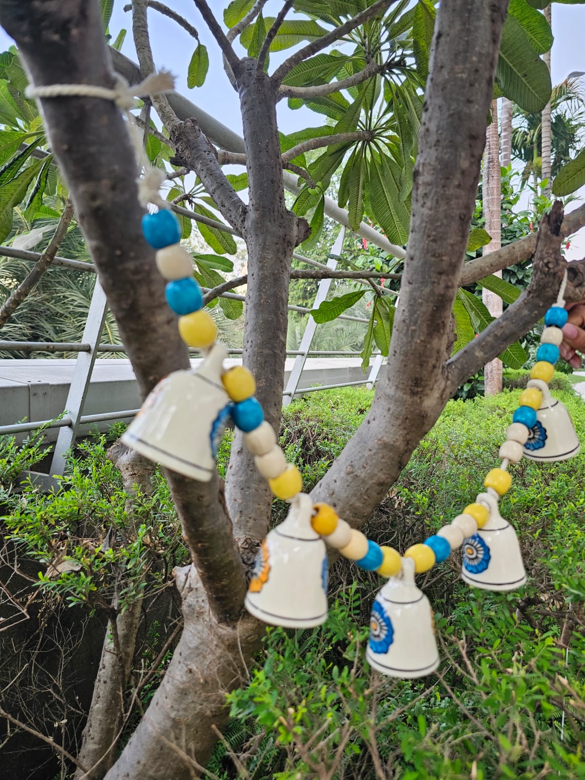 Ceramic Buntings- White Floral Bell+Blue-Yellow Beads